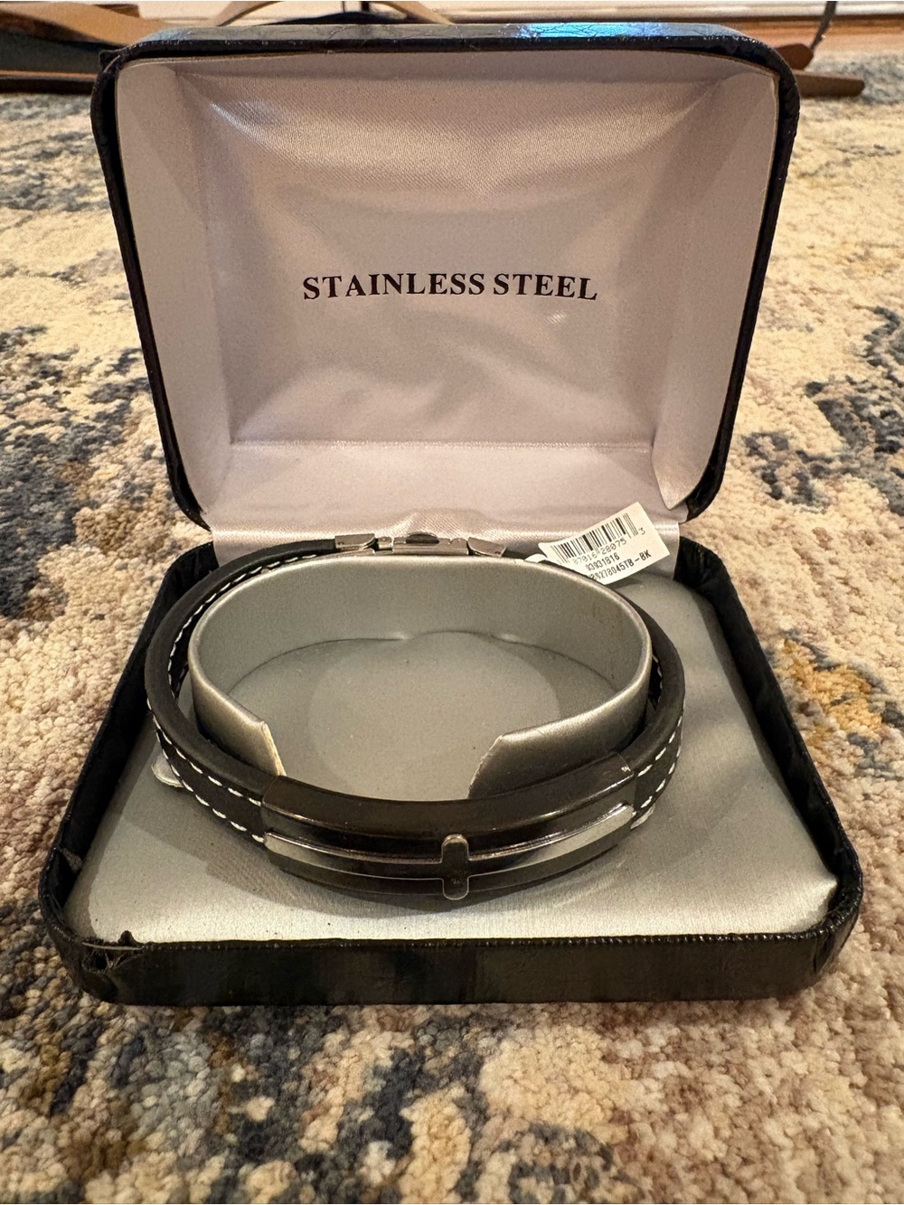 Stainless steel black leather bracelet with silver cross accents
